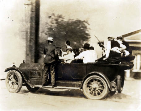 Group of armed white men in a car during the Tulsa Race Massacre, 1921