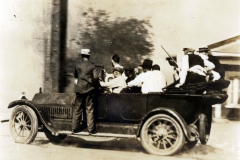 Group of armed white men in a car during the Tulsa Race Massacre, 1921