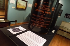 View of Civil Defense Water Storage Barrel in exhibit