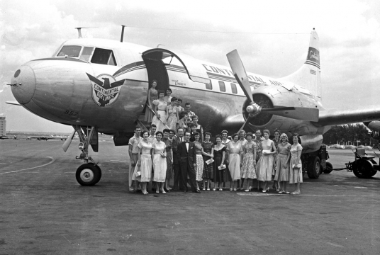 Tulsa Tech Group posing with airplane