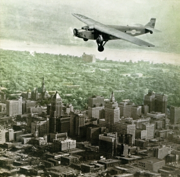 United Airlines plane flying over Tulsa, c. 1930