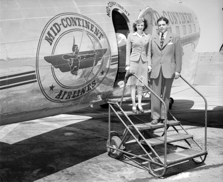 Boarding Mid-Continent Airlines airplane, c. late 1940s