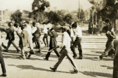 African American prisoners being marched at gunpoint.