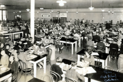 2002.598.01Tulsa High School Cafeteria - Students seated at tables