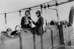 BFC A0284Junior League aerial tea party in 1920. Mrs. Knight (Lura Lynn) Douglas and Miss Doris Clarke are shown having tea with Duncan McIntyre.