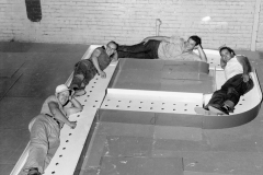 Workers pose with 800-pound "P" for lighted marquee to be installed on Tulsa Power Plant, Summer 1955